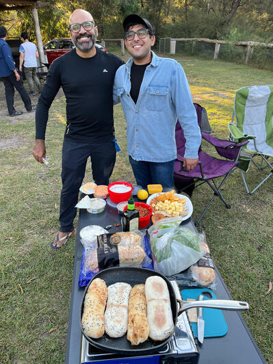 Sharing food at camping trip is the highlight.